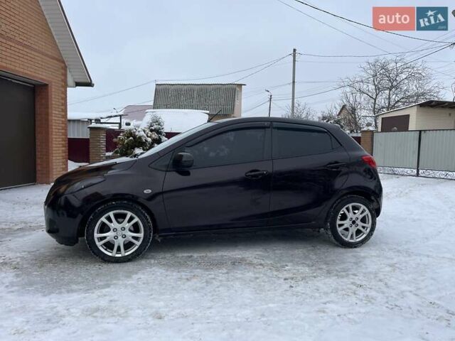 Фиолетовый Мазда 2, объемом двигателя 1.5 л и пробегом 221 тыс. км за 5650 $, фото 1 на Automoto.ua