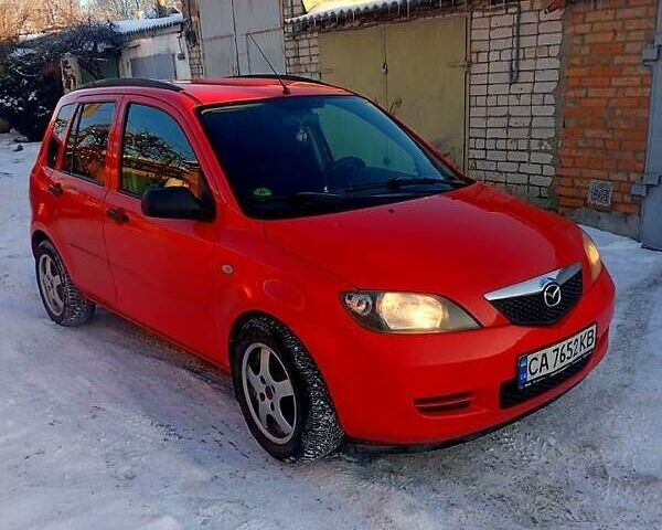 Красный Мазда 2, объемом двигателя 1.2 л и пробегом 160 тыс. км за 4000 $, фото 1 на Automoto.ua