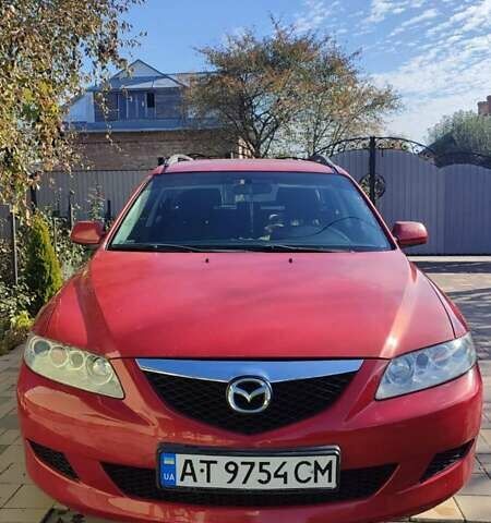 Красный Мазда 2, объемом двигателя 2 л и пробегом 265 тыс. км за 3650 $, фото 1 на Automoto.ua