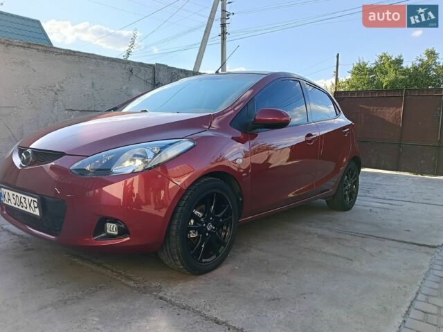 Красный Мазда 2, объемом двигателя 1.5 л и пробегом 160 тыс. км за 6200 $, фото 1 на Automoto.ua