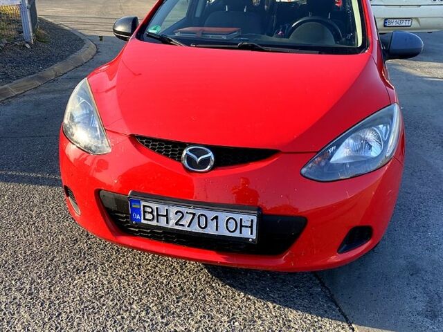 Красный Мазда 2, объемом двигателя 1.4 л и пробегом 232 тыс. км за 3900 $, фото 1 на Automoto.ua