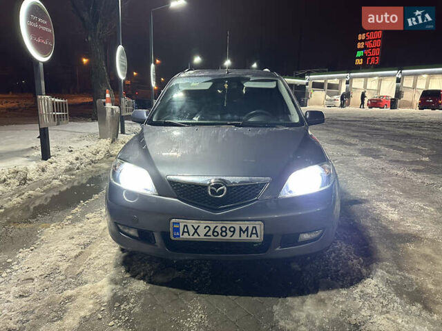 Серый Мазда 2, объемом двигателя 1.4 л и пробегом 260 тыс. км за 3900 $, фото 1 на Automoto.ua