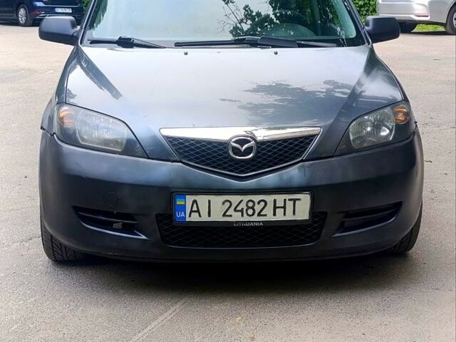 Сірий Мазда 2, об'ємом двигуна 1.4 л та пробігом 329 тис. км за 2700 $, фото 1 на Automoto.ua