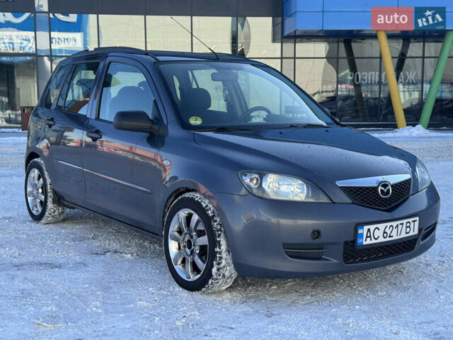 Серый Мазда 2, объемом двигателя 1.4 л и пробегом 254 тыс. км за 3550 $, фото 1 на Automoto.ua