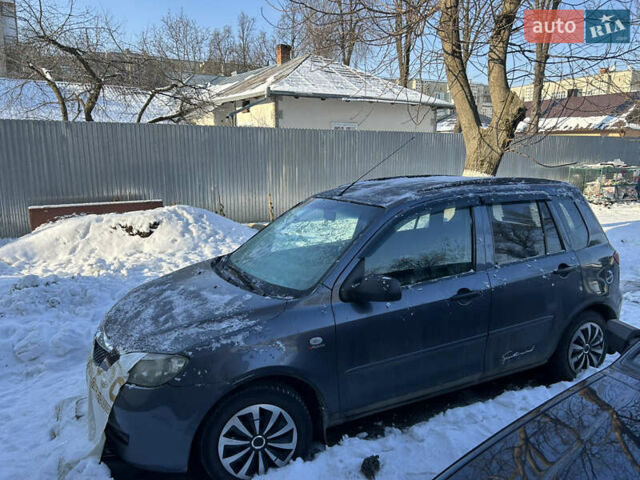 Серый Мазда 2, объемом двигателя 1.4 л и пробегом 200 тыс. км за 3200 $, фото 1 на Automoto.ua