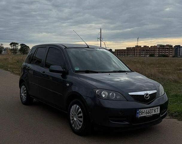 Серый Мазда 2, объемом двигателя 1.39 л и пробегом 148 тыс. км за 3500 $, фото 1 на Automoto.ua