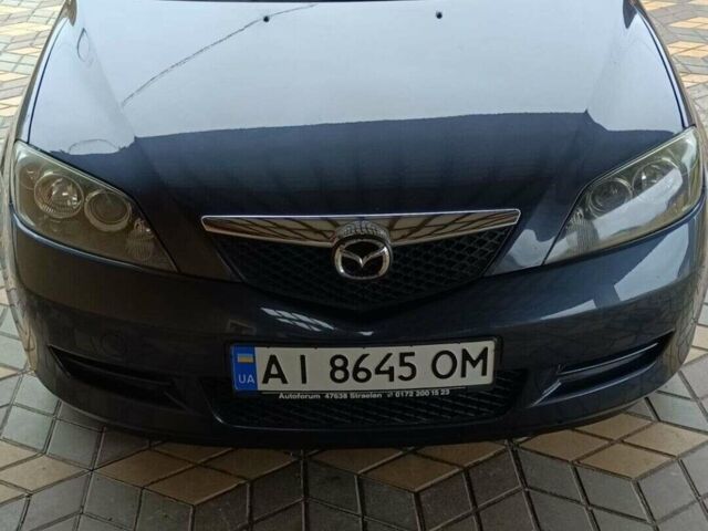 Сірий Мазда 2, об'ємом двигуна 1.4 л та пробігом 190 тис. км за 4850 $, фото 1 на Automoto.ua