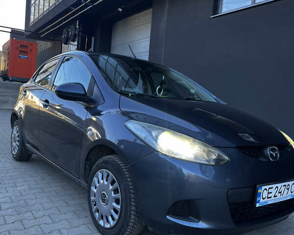 Серый Мазда 2, объемом двигателя 1.6 л и пробегом 116 тыс. км за 9300 $, фото 1 на Automoto.ua
