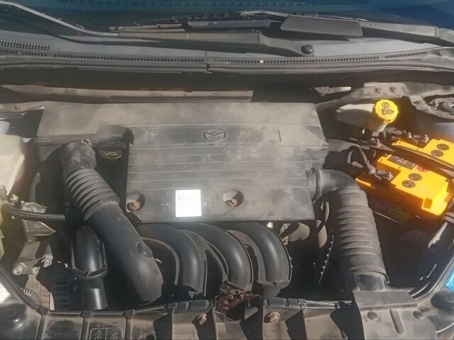 Синий Мазда 2, объемом двигателя 1.39 л и пробегом 176 тыс. км за 4800 $, фото 1 на Automoto.ua
