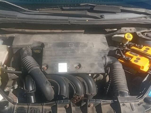 Синий Мазда 2, объемом двигателя 1.39 л и пробегом 176 тыс. км за 5000 $, фото 1 на Automoto.ua