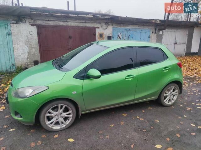 Зеленый Мазда 2, объемом двигателя 1.5 л и пробегом 147 тыс. км за 6000 $, фото 1 на Automoto.ua