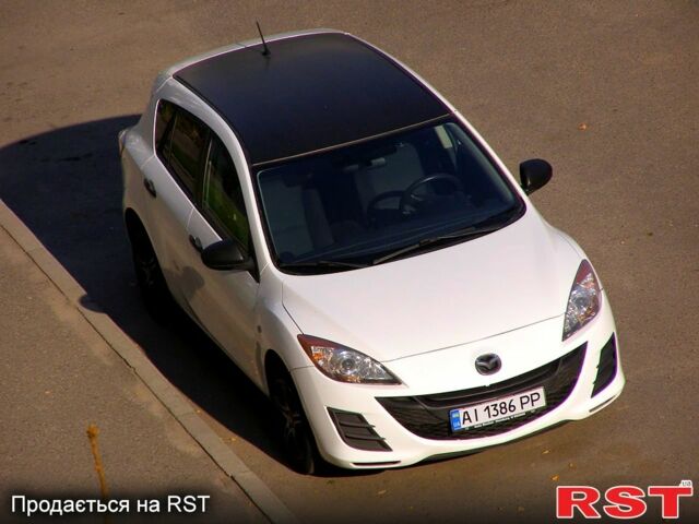 Білий Мазда 3, об'ємом двигуна 1.6 л та пробігом 230 тис. км за 6950 $, фото 1 на Automoto.ua
