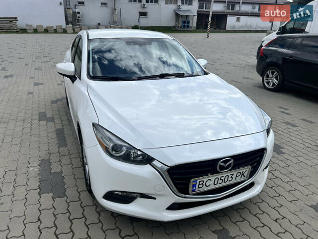 Белый Мазда 3, объемом двигателя 2 л и пробегом 55 тыс. км за 11700 $, фото 1 на Automoto.ua