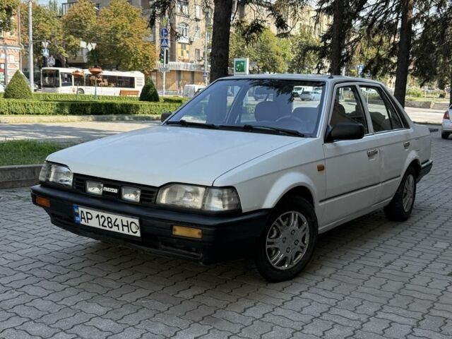 Білий Мазда 3, об'ємом двигуна 1.3 л та пробігом 281 тис. км за 851 $, фото 1 на Automoto.ua