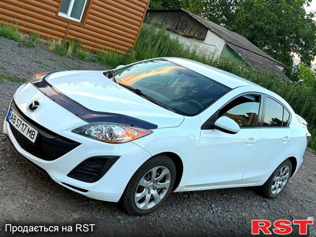 Белый Мазда 3, объемом двигателя 2 л и пробегом 140 тыс. км за 7800 $, фото 1 на Automoto.ua