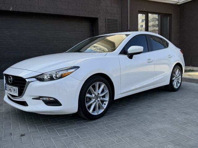 Белый Мазда 3, объемом двигателя 2 л и пробегом 63 тыс. км за 14100 $, фото 1 на Automoto.ua