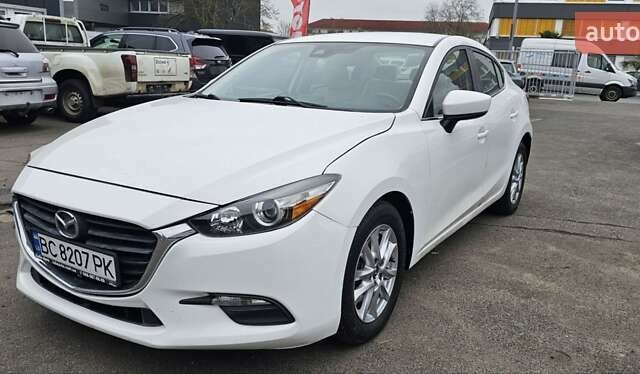 Белый Мазда 3, объемом двигателя 2 л и пробегом 130 тыс. км за 9900 $, фото 1 на Automoto.ua