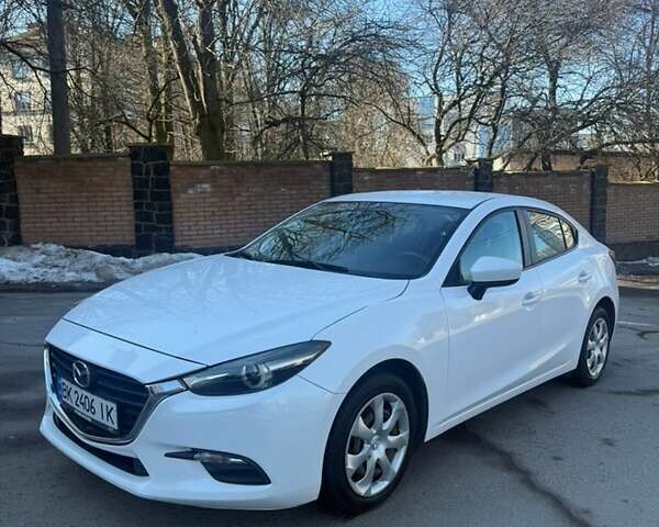 Белый Мазда 3, объемом двигателя 2 л и пробегом 57 тыс. км за 14000 $, фото 1 на Automoto.ua
