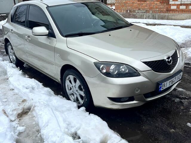 Бежевый Мазда 3, объемом двигателя 1.6 л и пробегом 244 тыс. км за 4650 $, фото 1 на Automoto.ua