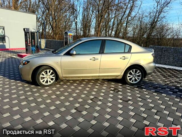 Бежевий Мазда 3, об'ємом двигуна 2 л та пробігом 247 тис. км за 5250 $, фото 1 на Automoto.ua