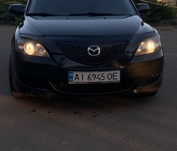 Черный Мазда 3, объемом двигателя 1.6 л и пробегом 237 тыс. км за 4100 $, фото 1 на Automoto.ua