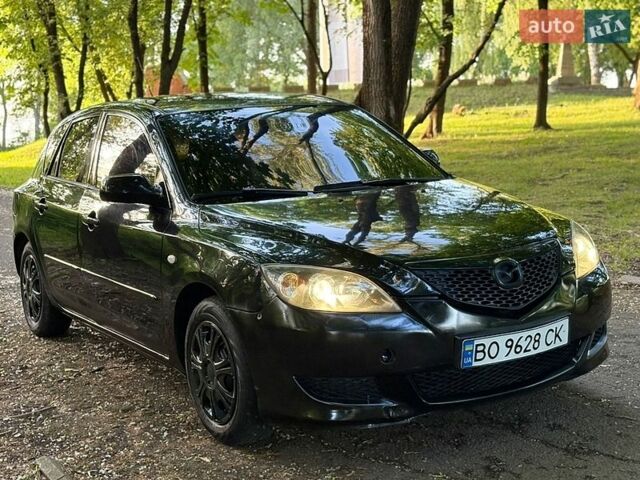 Чорний Мазда 3, об'ємом двигуна 1.35 л та пробігом 321 тис. км за 2700 $, фото 1 на Automoto.ua