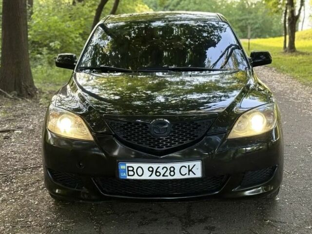 Черный Мазда 3, объемом двигателя 1.4 л и пробегом 321 тыс. км за 2850 $, фото 1 на Automoto.ua
