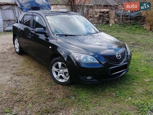 Черный Мазда 3, объемом двигателя 2 л и пробегом 182 тыс. км за 4200 $, фото 1 на Automoto.ua