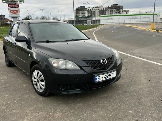 Черный Мазда 3, объемом двигателя 1.3 л и пробегом 190 тыс. км за 3200 $, фото 1 на Automoto.ua