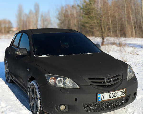 Чорний Мазда 3, об'ємом двигуна 2 л та пробігом 372 тис. км за 3900 $, фото 1 на Automoto.ua