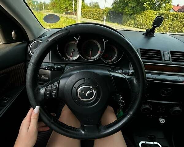 Черный Мазда 3, объемом двигателя 2 л и пробегом 235 тыс. км за 5500 $, фото 1 на Automoto.ua