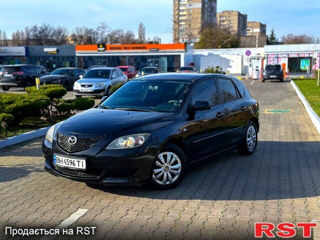 Черный Мазда 3, объемом двигателя 1.3 л и пробегом 200 тыс. км за 3799 $, фото 1 на Automoto.ua