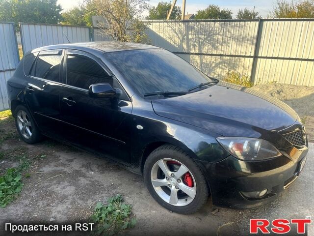 Черный Мазда 3, объемом двигателя 1.6 л и пробегом 200 тыс. км за 2200 $, фото 1 на Automoto.ua