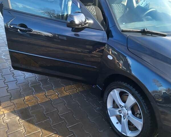 Черный Мазда 3, объемом двигателя 2 л и пробегом 193 тыс. км за 6000 $, фото 1 на Automoto.ua