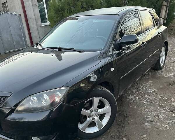 Черный Мазда 3, объемом двигателя 1.6 л и пробегом 199 тыс. км за 3700 $, фото 1 на Automoto.ua