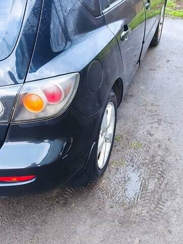 Черный Мазда 3, объемом двигателя 1.6 л и пробегом 260 тыс. км за 2800 $, фото 1 на Automoto.ua