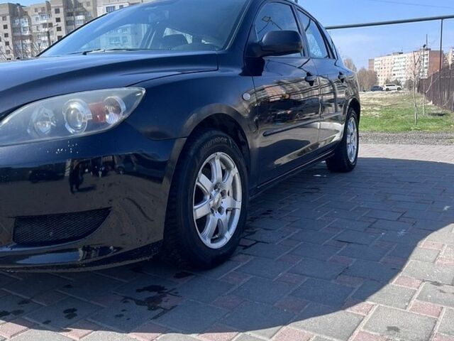 Черный Мазда 3, объемом двигателя 1.56 л и пробегом 298 тыс. км за 4000 $, фото 1 на Automoto.ua