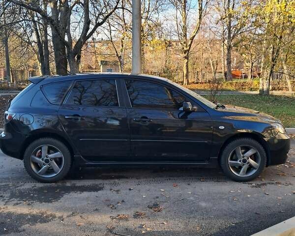 Черный Мазда 3, объемом двигателя 1.56 л и пробегом 233 тыс. км за 5200 $, фото 1 на Automoto.ua