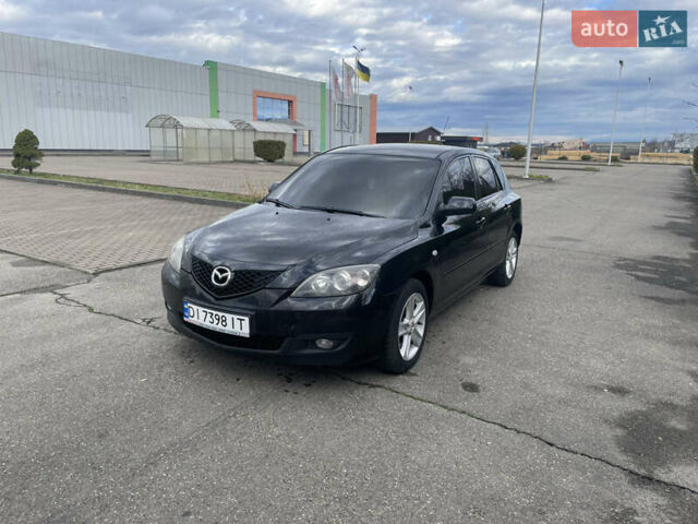 Черный Мазда 3, объемом двигателя 2 л и пробегом 252 тыс. км за 4000 $, фото 1 на Automoto.ua
