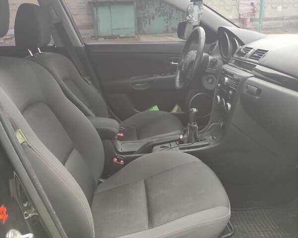 Черный Мазда 3, объемом двигателя 2 л и пробегом 226 тыс. км за 5700 $, фото 1 на Automoto.ua
