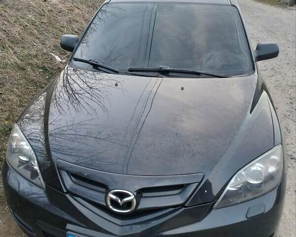 Черный Мазда 3, объемом двигателя 1.6 л и пробегом 200 тыс. км за 6000 $, фото 1 на Automoto.ua