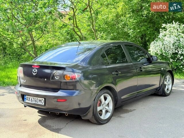 Черный Мазда 3, объемом двигателя 1.6 л и пробегом 255 тыс. км за 4200 $, фото 1 на Automoto.ua