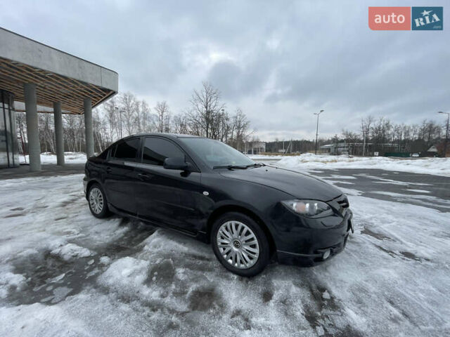 Черный Мазда 3, объемом двигателя 2 л и пробегом 266 тыс. км за 3950 $, фото 1 на Automoto.ua