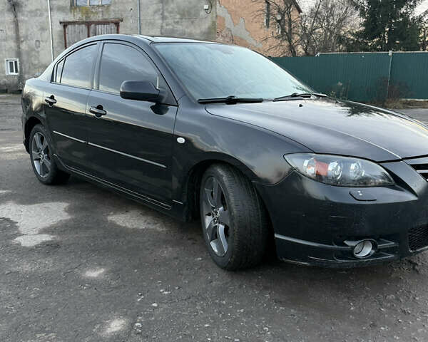 Черный Мазда 3, объемом двигателя 2 л и пробегом 260 тыс. км за 4950 $, фото 1 на Automoto.ua