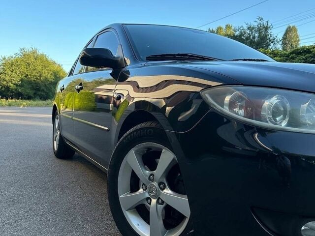 Чорний Мазда 3, об'ємом двигуна 1.6 л та пробігом 201 тис. км за 5500 $, фото 1 на Automoto.ua
