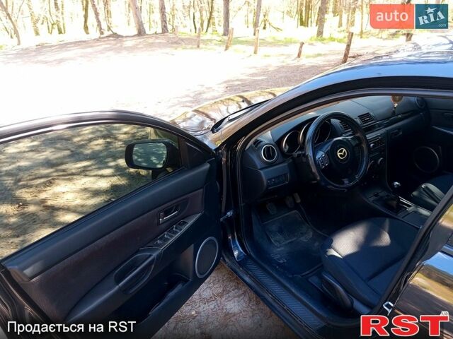 Черный Мазда 3, объемом двигателя 1.6 л и пробегом 257 тыс. км за 4000 $, фото 1 на Automoto.ua