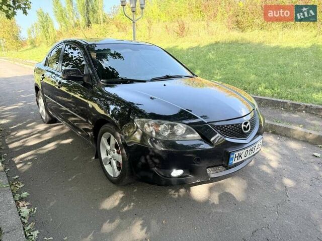 Черный Мазда 3, объемом двигателя 1.6 л и пробегом 285 тыс. км за 4599 $, фото 1 на Automoto.ua