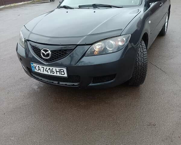 Черный Мазда 3, объемом двигателя 1.6 л и пробегом 232 тыс. км за 5850 $, фото 1 на Automoto.ua