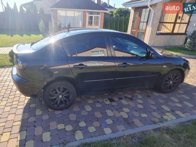 Чорний Мазда 3, об'ємом двигуна 1.6 л та пробігом 256 тис. км за 4600 $, фото 1 на Automoto.ua