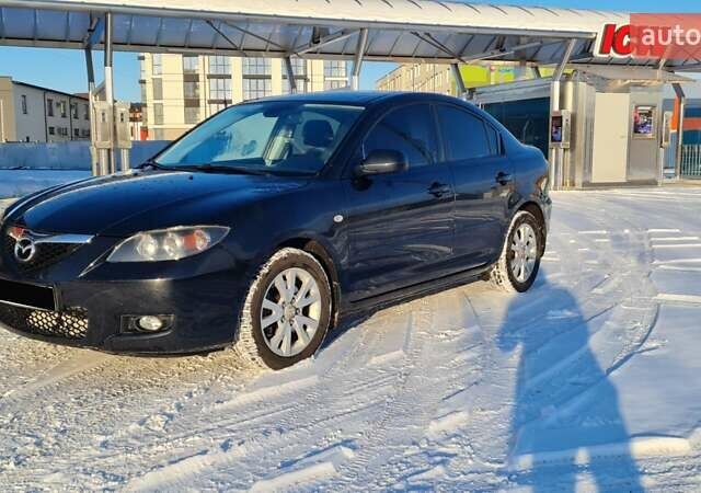 Черный Мазда 3, объемом двигателя 2 л и пробегом 255 тыс. км за 5000 $, фото 1 на Automoto.ua